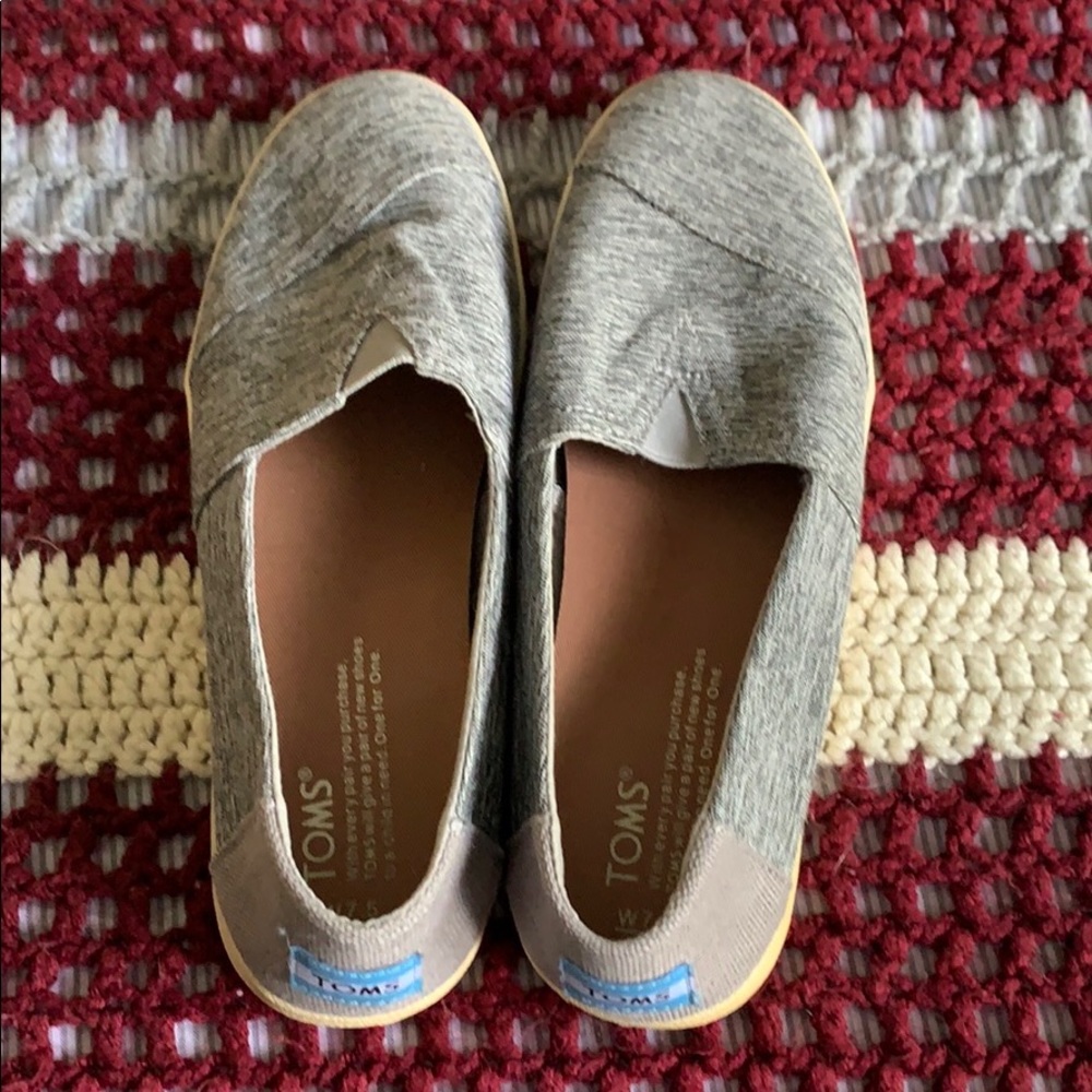 Gently used gray Toms slip-ons size 7.5